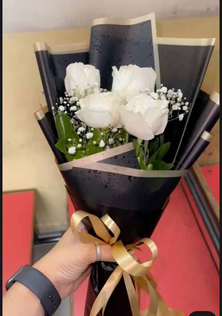 White roses with imported baby breaths